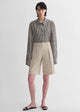 Sophisticated linen waistless pleated wide-leg cropped pants for women, featuring architectural silhouette, textured side pockets